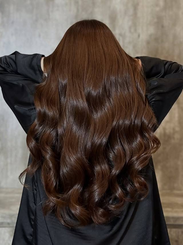 3. Glossy Chestnut Brown Hollywood Waves - Cool Brown Hair Color