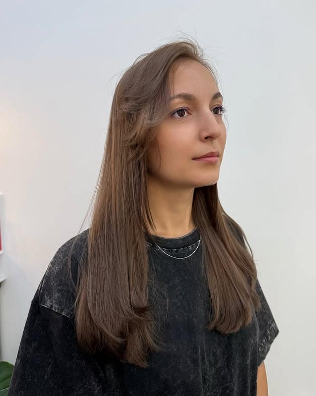 9. Natural Light Brown Sleek Layers - Cool Brown Hair Color
