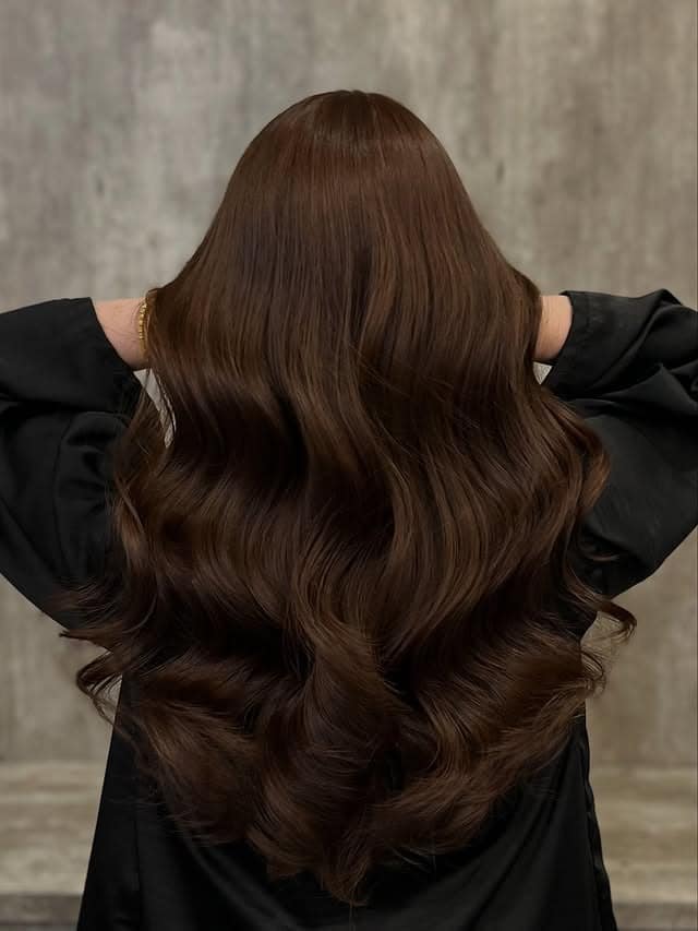 11. Rich Chocolate Brown Long Layered Waves - Cool Brown Hair Color