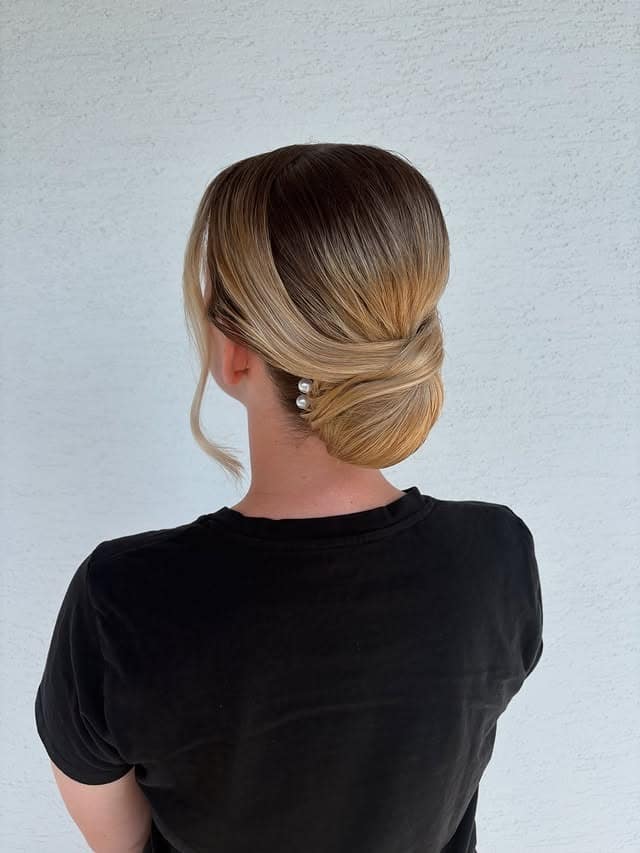17. Minimalist Ash Blonde Low Knot with Pearl Pins - Updo Hairstyles