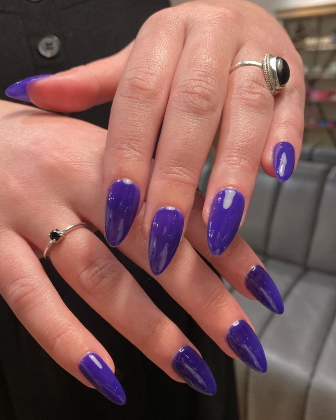 5. Deep Glossy Purple Almond Nails - short purple nail ideas