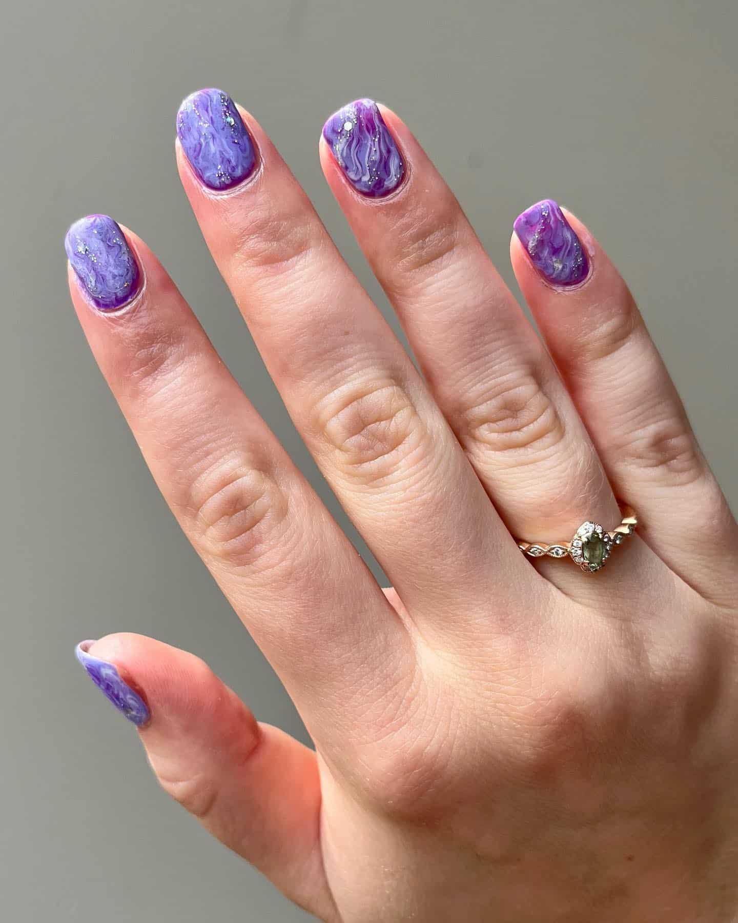 13. Marble Purple Short Round Nails - short purple nail ideas