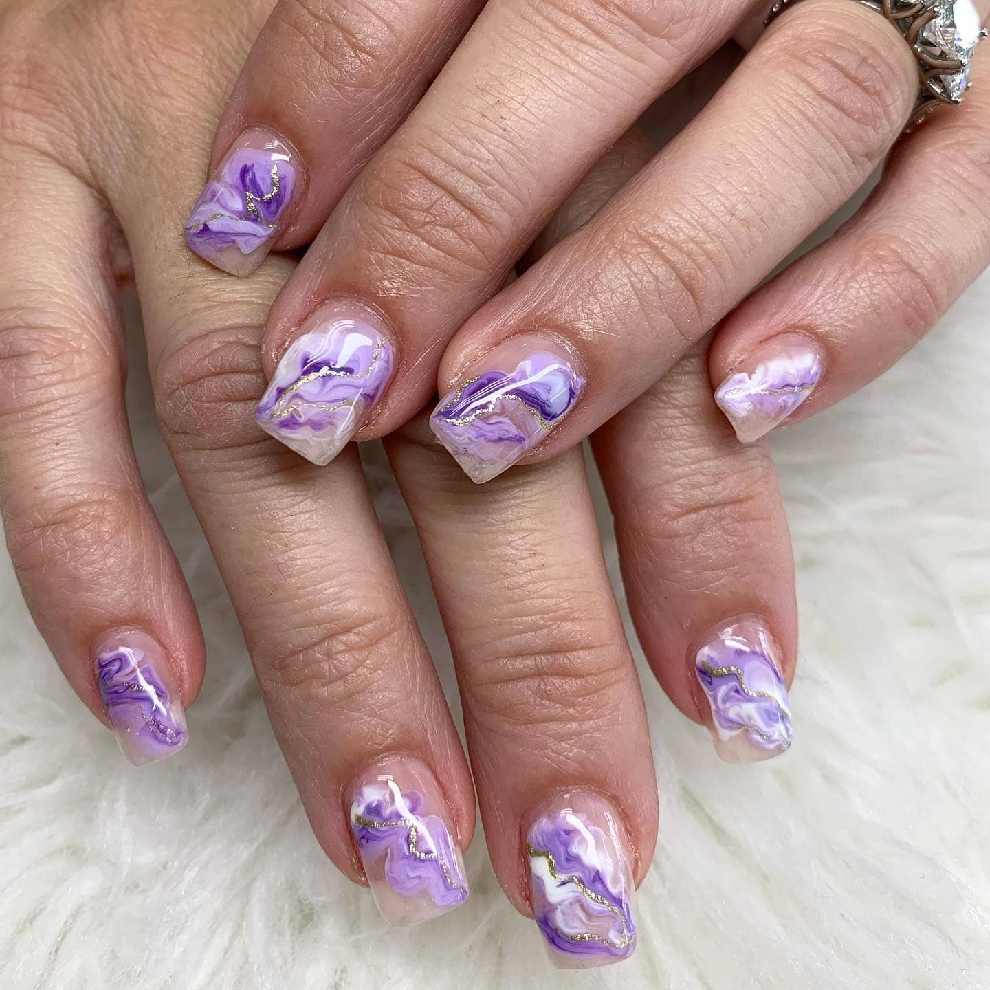 18. Purple and White Marble Square Nails with Gold Veining - short purple nail ideas
