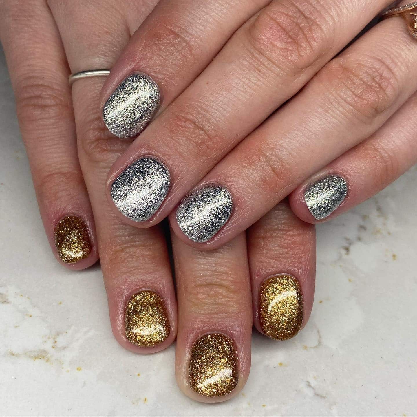 3. Short Silver and Gold Glitter Contrast Nails - silver and gold nail ideas