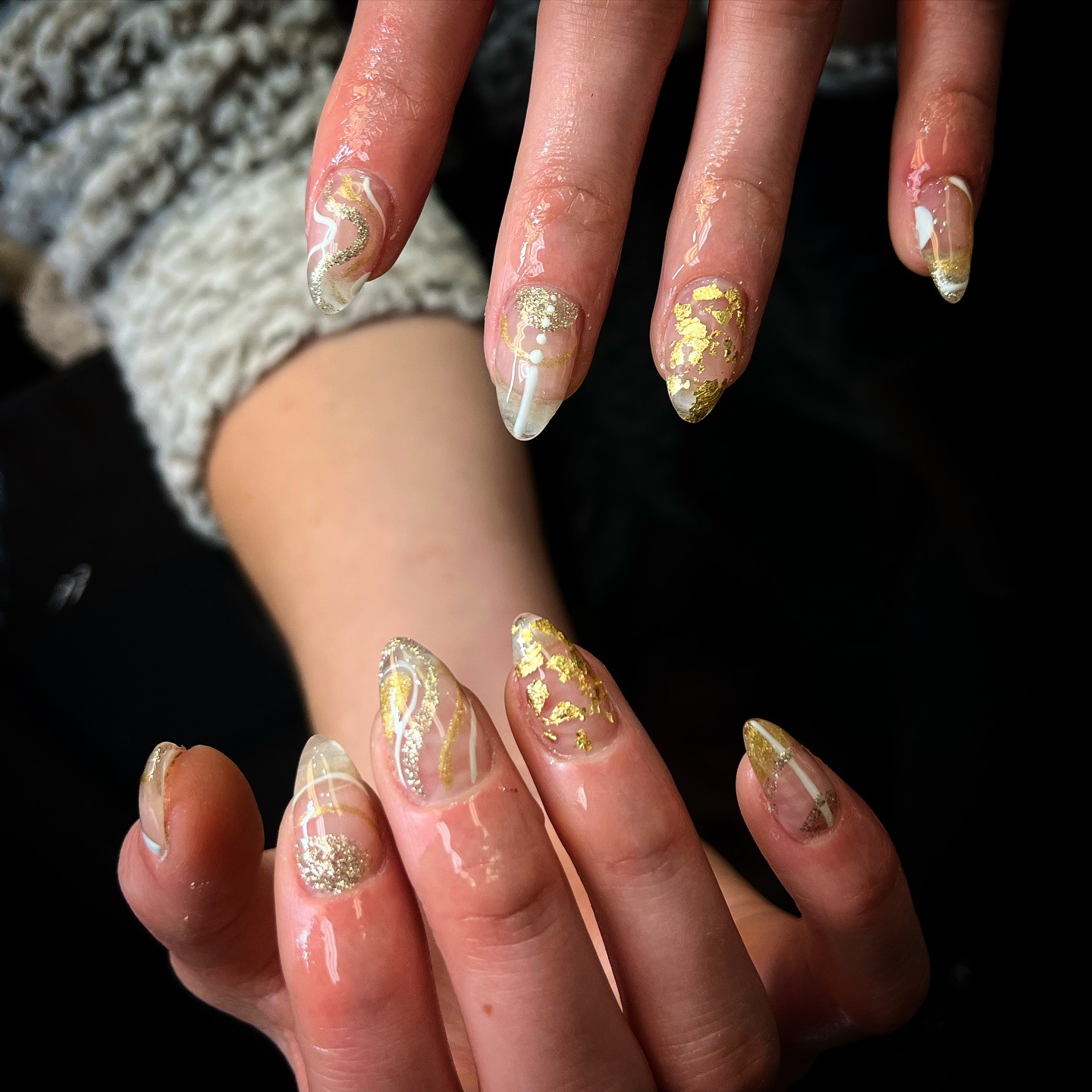 5. Abstract Clear Nails with Gold Foil and White Detailing - silver and gold nail ideas