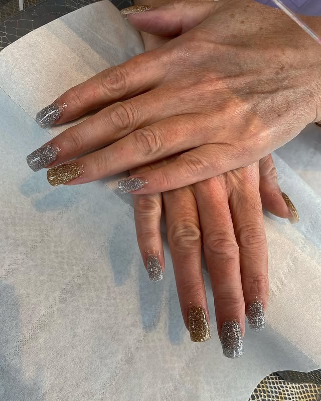 6. Subtle Nude Almond Nails with Gold Foil Flakes - silver and gold nail ideas