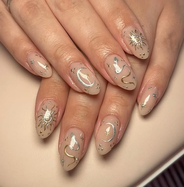 19. Nude Almond Nails with Celestial Gold and Silver Art - silver and gold nail ideas
