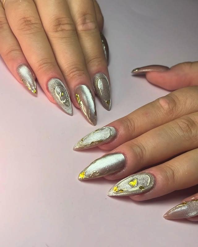 20. Metallic Silver Almond Nails with Gold Foil Accents - silver and gold nail ideas