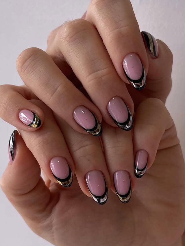 21. Glossy Nude Oval Nails with Black and Gold Chrome Tips - silver and gold nail ideas