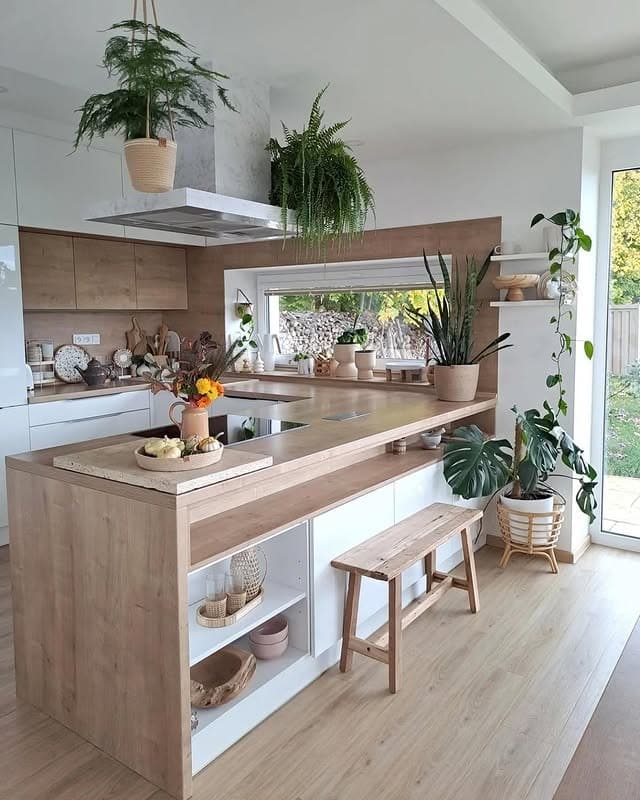 16. Minimal Organic Kitchen with Light Wood Island and Greenery - boho kitchen ideas