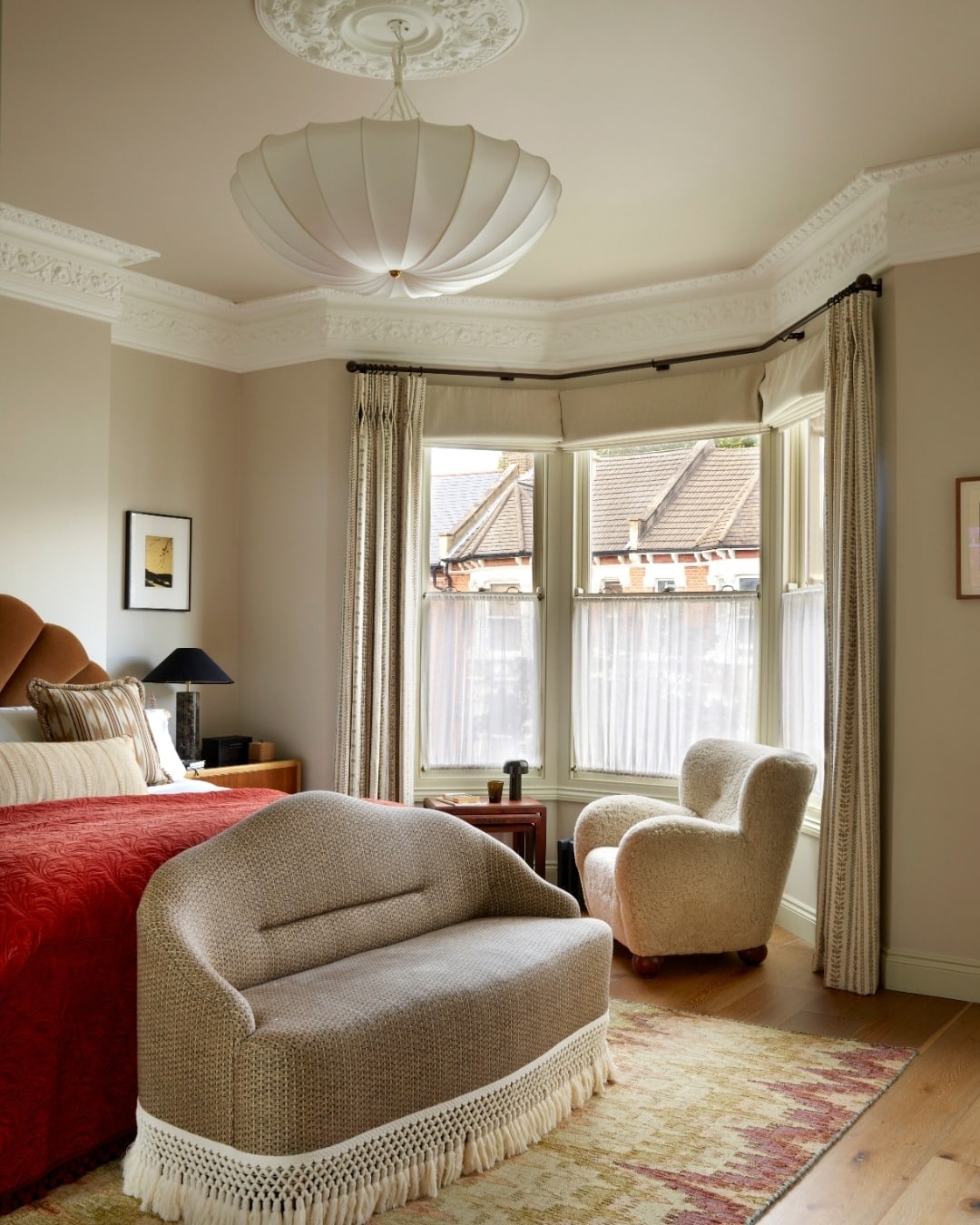 17. Traditional Bay Window Bedroom with Cozy Sofa Seating - sofa in bedroom ideas