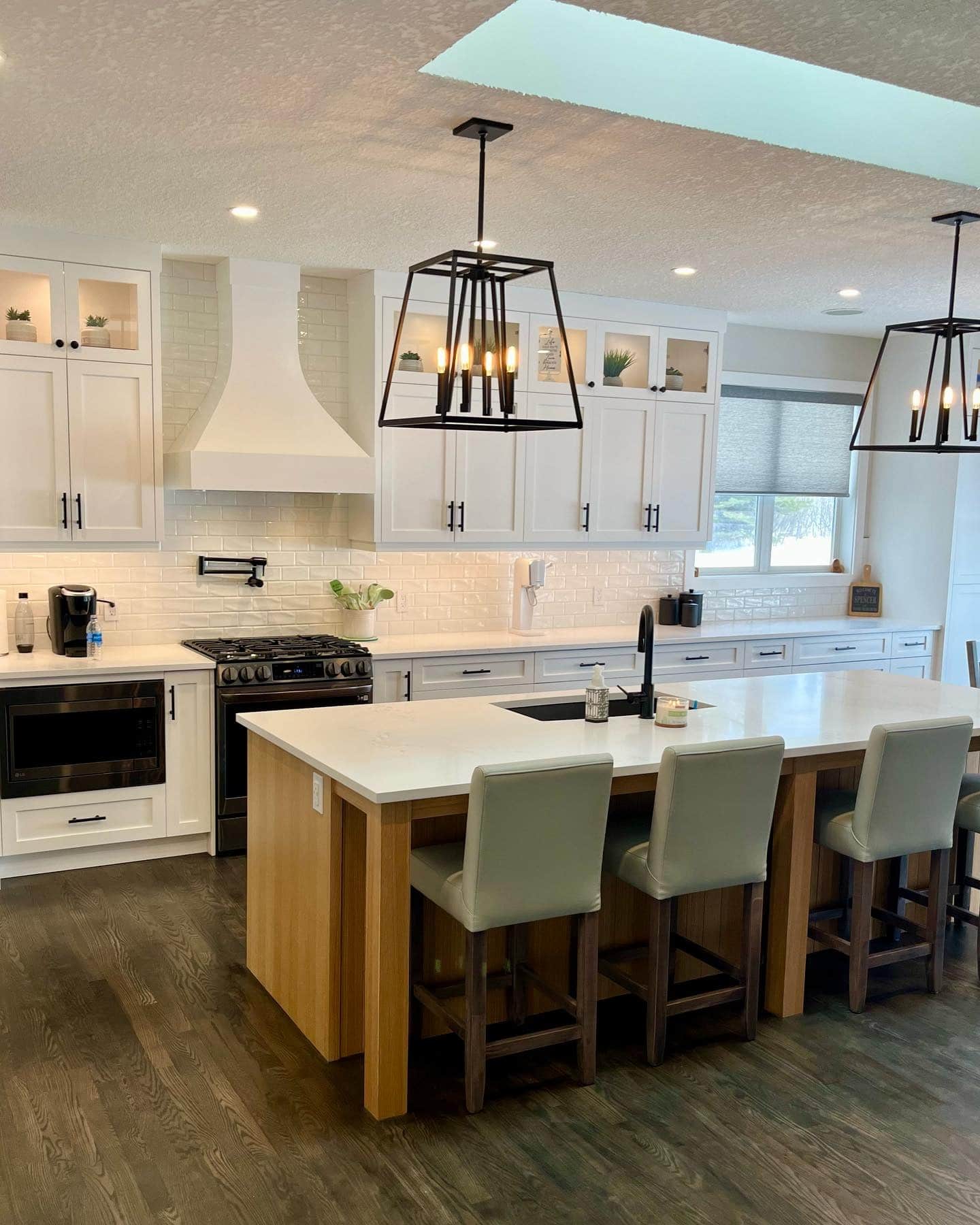 5. Warm Wood Island with Contemporary Black Lighting - farmhouse kitchen island ideas