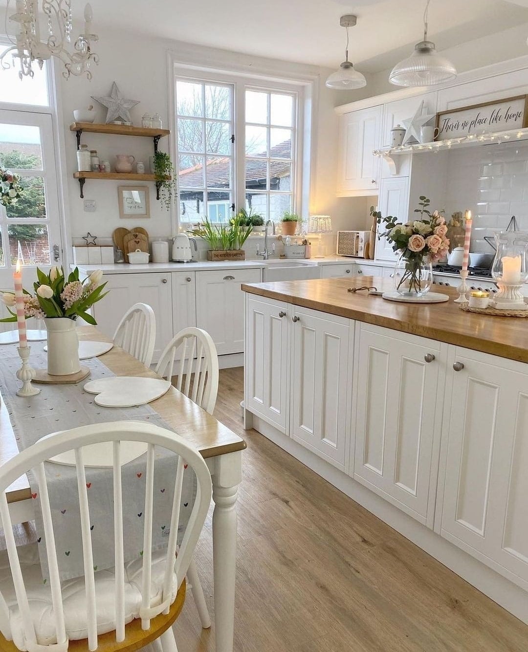 6. Classic White Kitchen with Lantern-Style Pendants - farmhouse kitchen island ideas