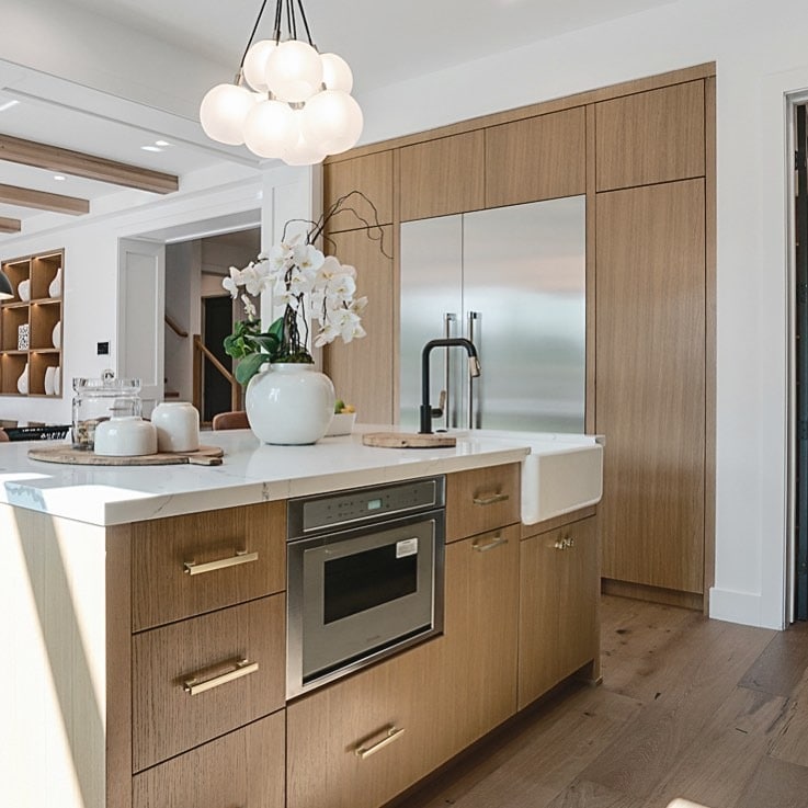 15. Light Wood Island with Modern White Countertop - farmhouse kitchen island ideas