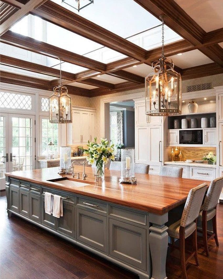 18. Gray Base Island with Statement Wood Top and Chandelier Lighting - farmhouse kitchen island ideas