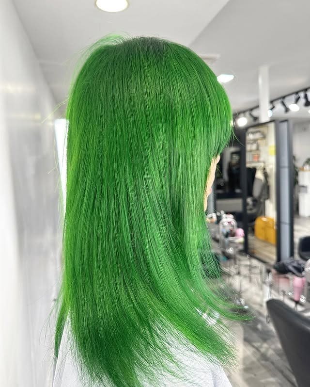6. Vibrant Green Straight Layers - Green Hair Color