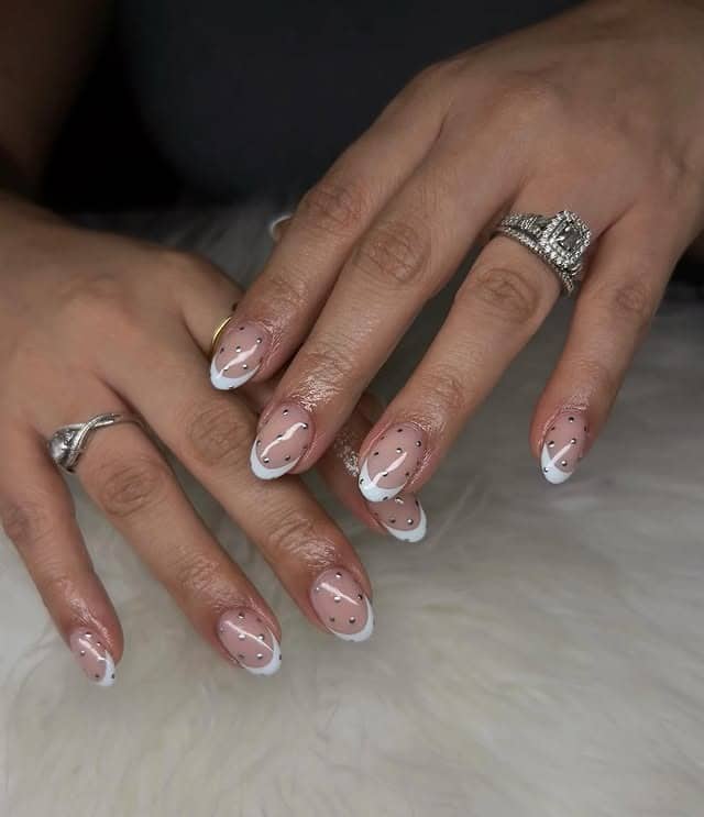 7. White Tip French with Rhinestone Dot Detailing - silver and white nail ideas