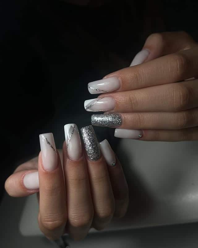 11. Nude and White Diagonal French with Silver Glitter Accent - silver and white nail ideas