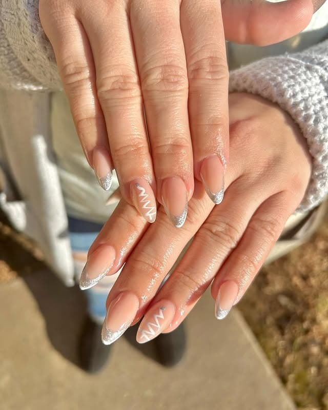 12. Almond Nude French Tips with Silver Glitter Edging - silver and white nail ideas
