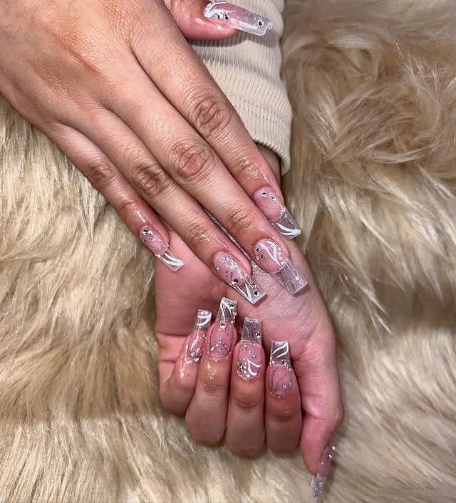 16. Clear Acrylic and White Swirl Nails with Silver Rhinestones - silver and white nail ideas