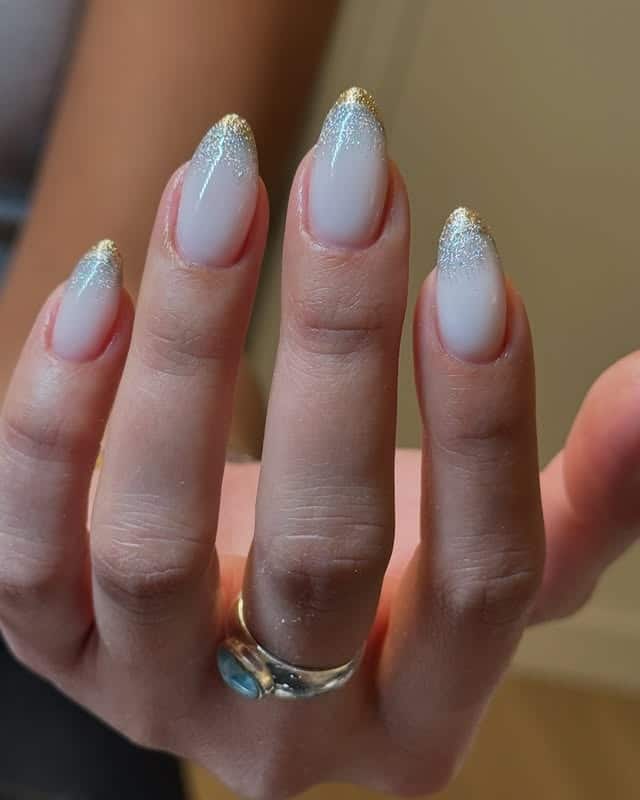 22. Milky White Ombre Almond Nails with Silver Glitter Tips - silver and white nail ideas
