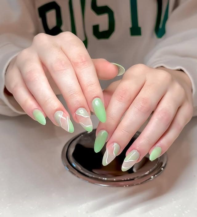 2. Abstract Mint Swirl Almond Nails - simple green nail ideas