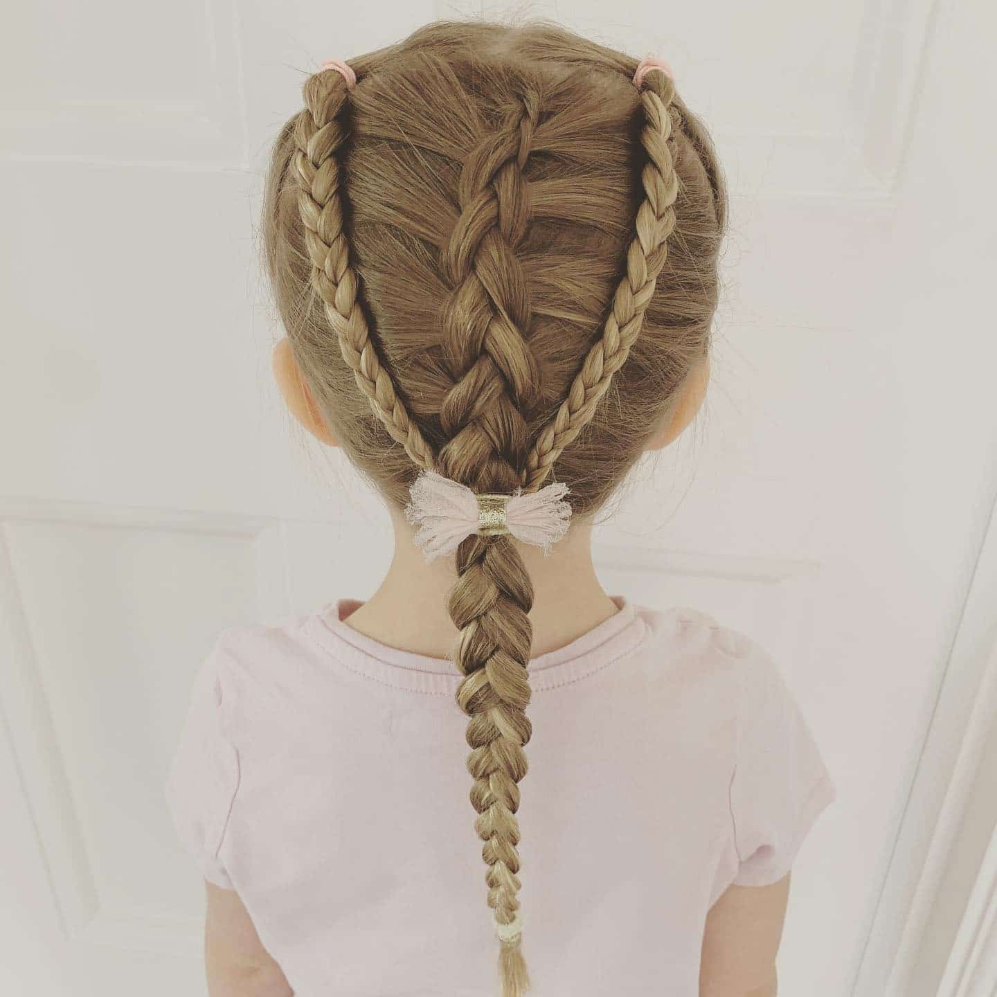 7. Soft Blonde Center Braid with Side Accent Braids - Pigtail Hairstyles