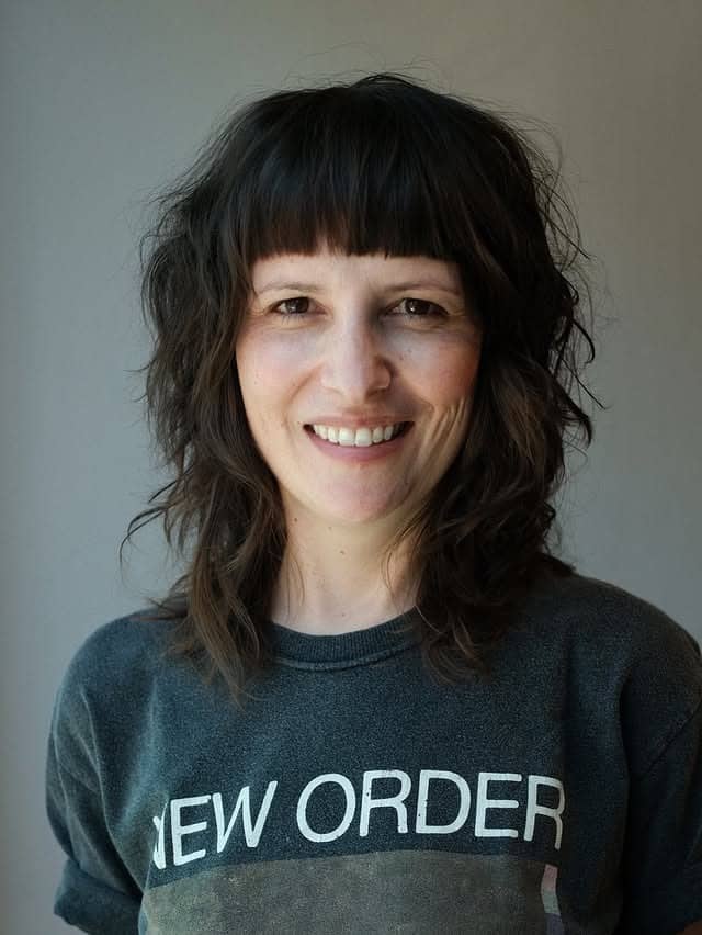 15. Curly Layered Bob with Natural Black - Messy Haircut For Women