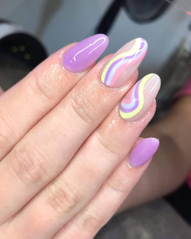 11. Pastel Swirl Almond Nails in Lilac and Butter Yellow - simple pastel nail ideas
