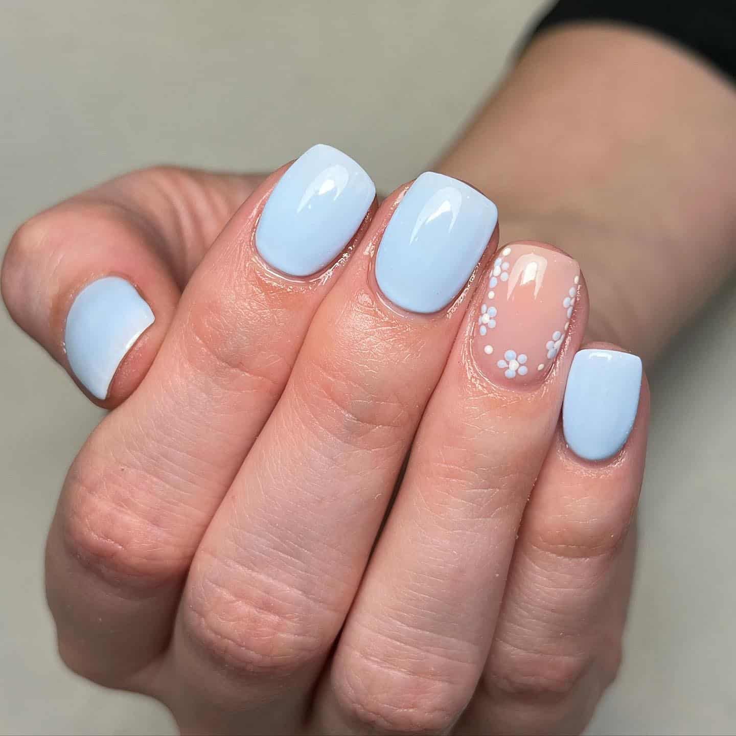 18. Soft Blue Short Nails with Daisy Accent - simple pastel nail ideas