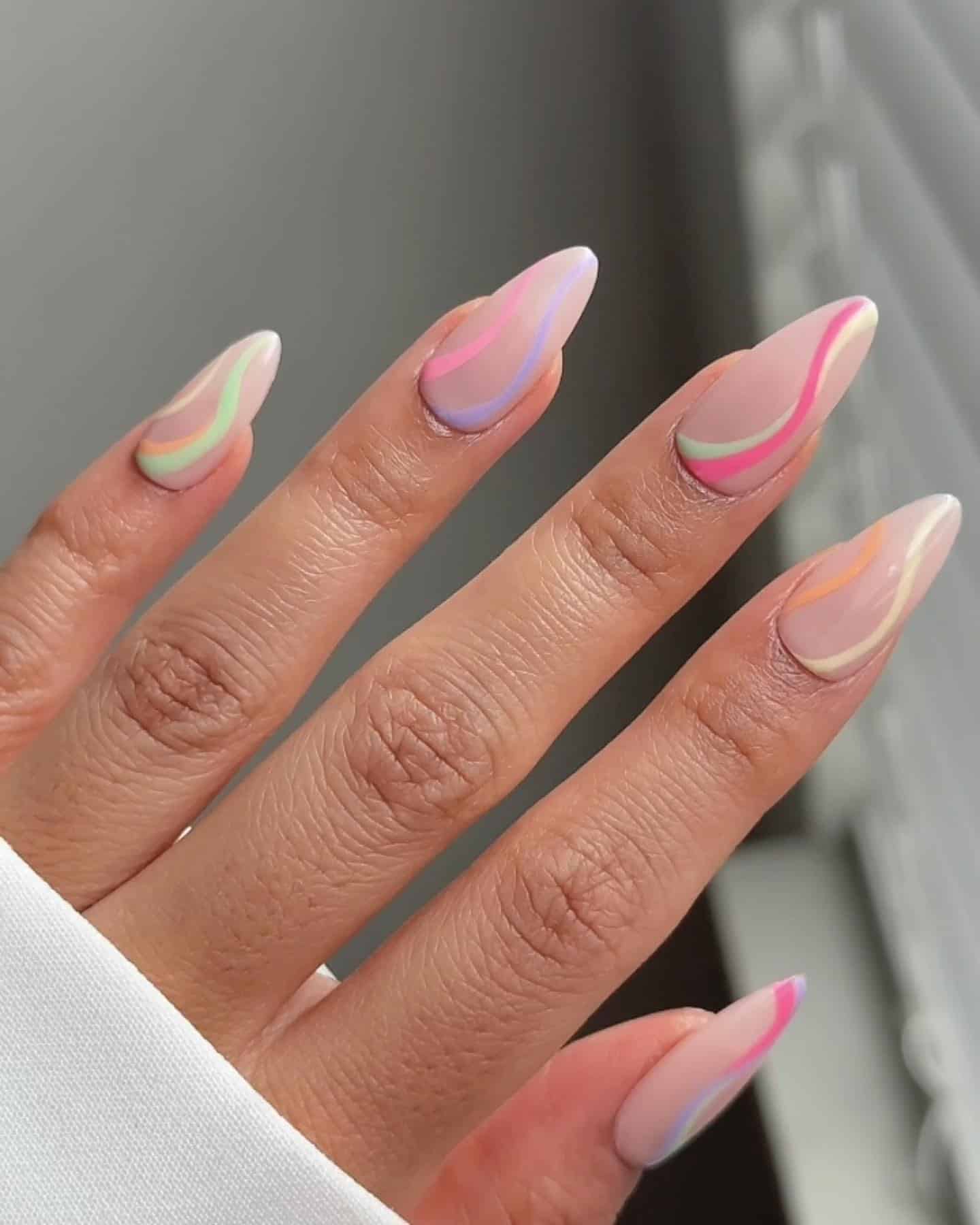 22. Pastel Rainbow Swirl Almond Nails on Sheer Base - simple pastel nail ideas