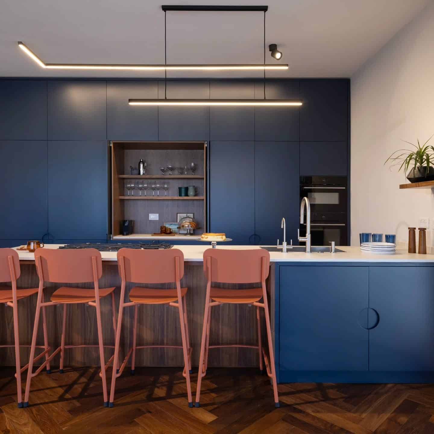 7. Minimalist Dark Blue Kitchen with Integrated Lighting - blue kitchen ideas