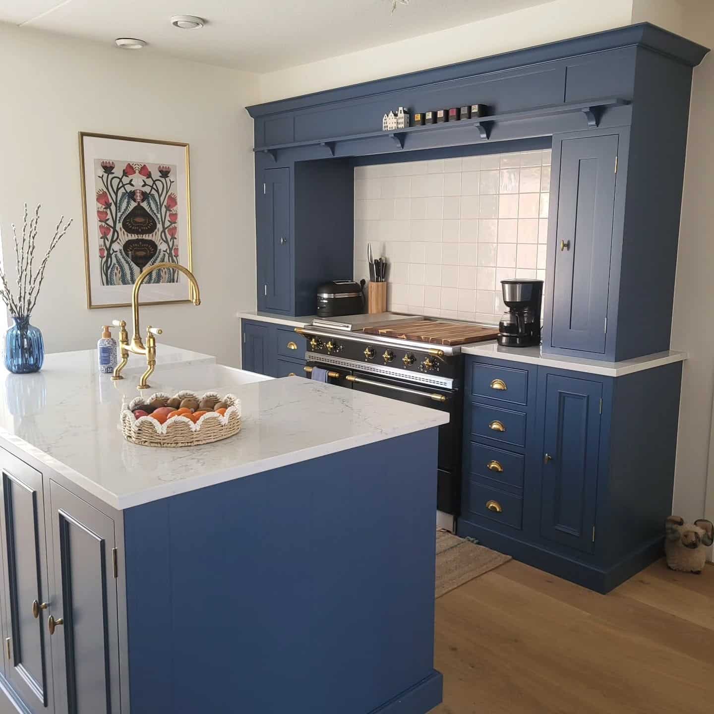 9. Heritage-Inspired Blue Kitchen with Brass Details - blue kitchen ideas