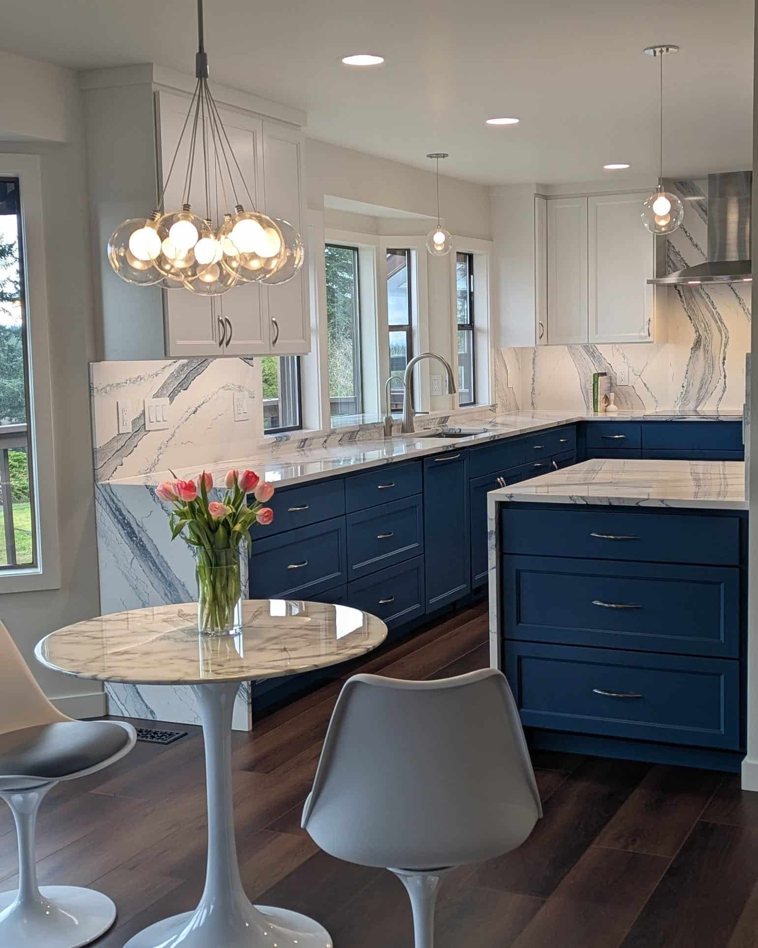11. Navy and White Marble Kitchen with Contemporary Lighting - blue kitchen ideas
