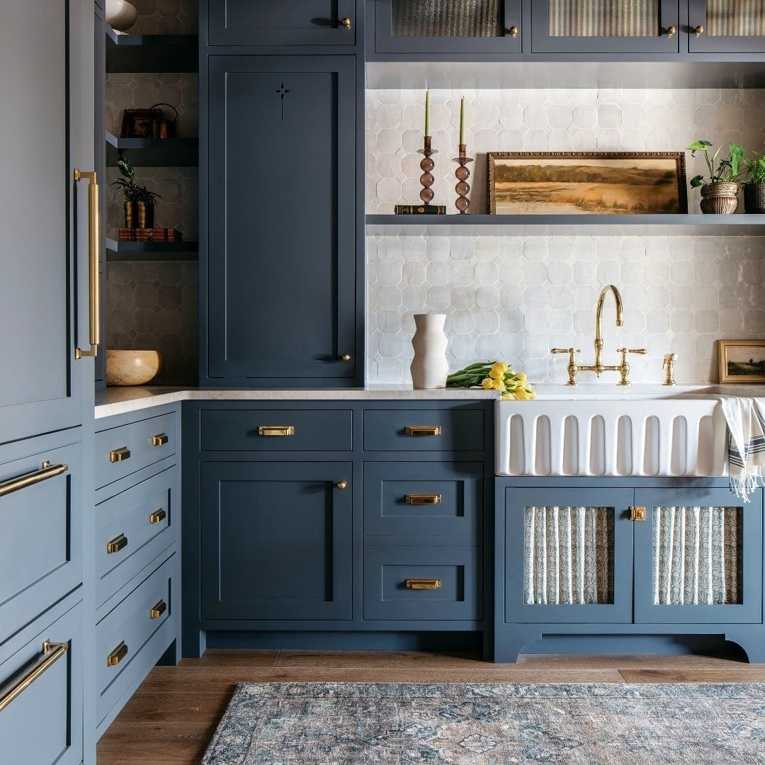 16. Heritage Blue Kitchen with Decorative Paneling and Brass Fixtures - blue kitchen ideas
