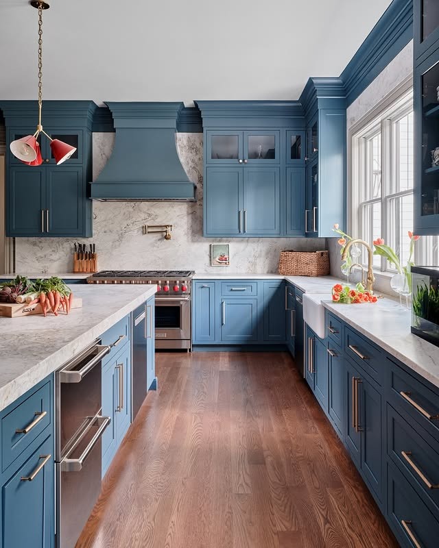 19. Classic Blue Kitchen with Statement Range Hood and Marble Details - blue kitchen ideas