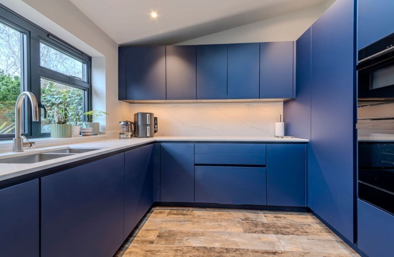 21. Sleek Matte Blue Kitchen with Minimalist Design - blue kitchen ideas