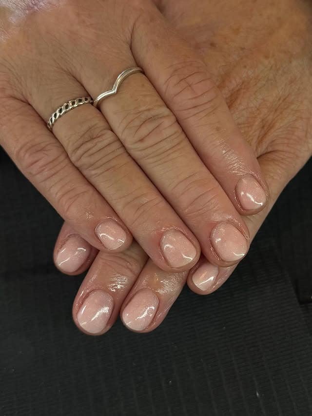 2. Short Glossy Nude Natural Nails - simple sparkly nail ideas