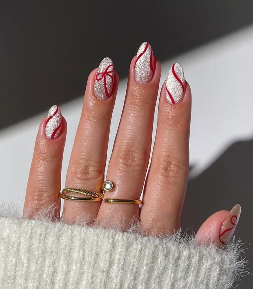 19. White Glitter Almond Nails with Red Ribbon Detail - simple sparkly nail ideas