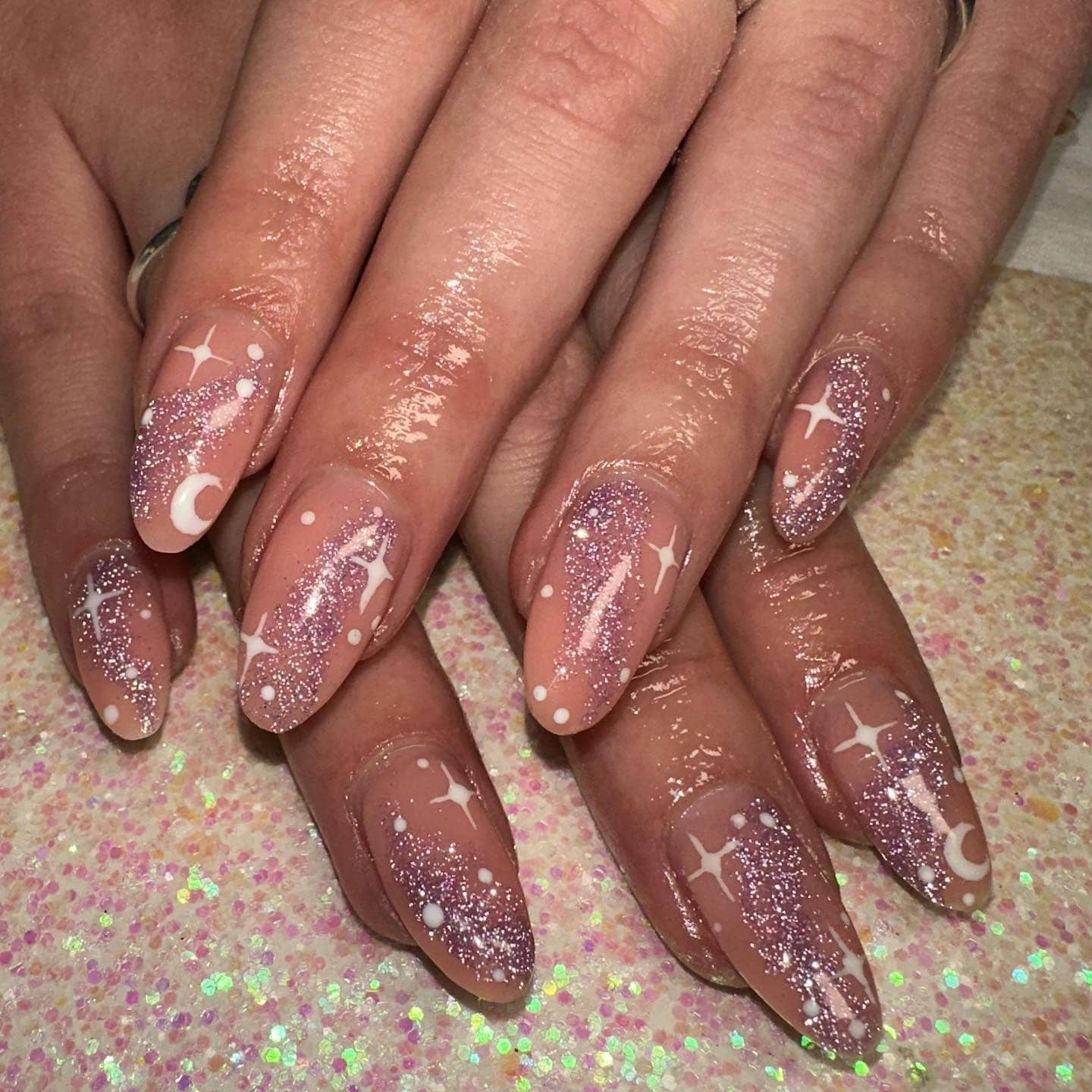 21. Nude Almond Nails with Pink Glitter Celestial Art - simple sparkly nail ideas
