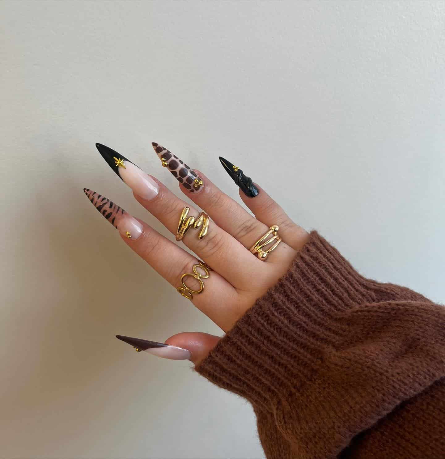 9. Brown and Black Animal Print Stiletto Nails with Gold Details - simple stiletto nail ideas