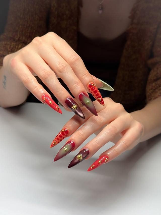 12. Red and Burgundy Ombre Stiletto with Gold Accents - simple stiletto nail ideas