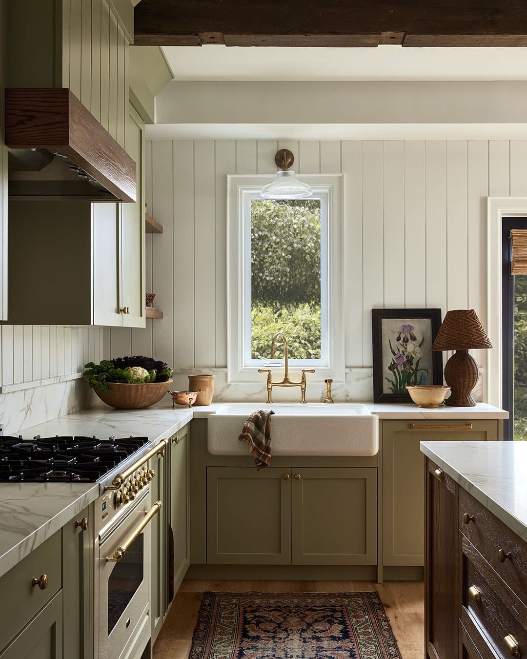 1. Classic Cream Galley Kitchen with Brass Accents - long kitchen ideas