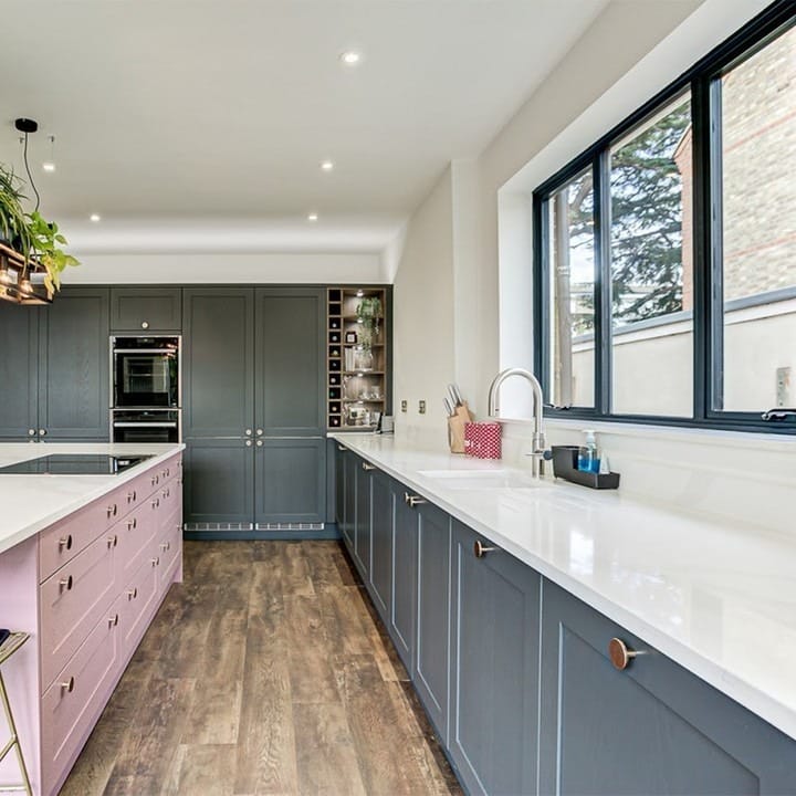 2. Modern Two-Tone Long Kitchen with Extended Counterline - long kitchen ideas