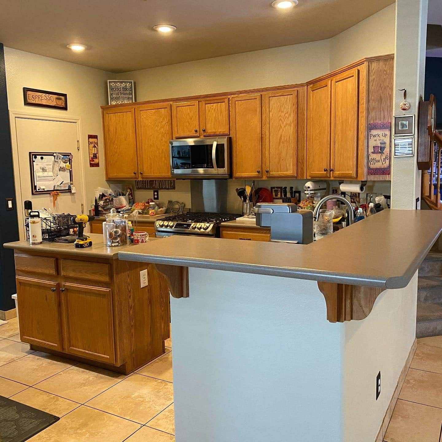 9. Warm Wood Traditional Kitchen with Extended Cabinet Wall - long kitchen ideas