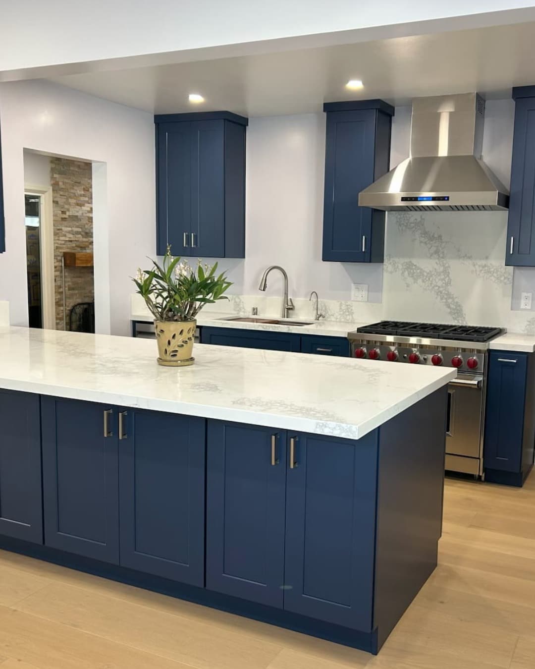 11. Navy Blue Island Kitchen with Crisp White Countertops - long kitchen ideas