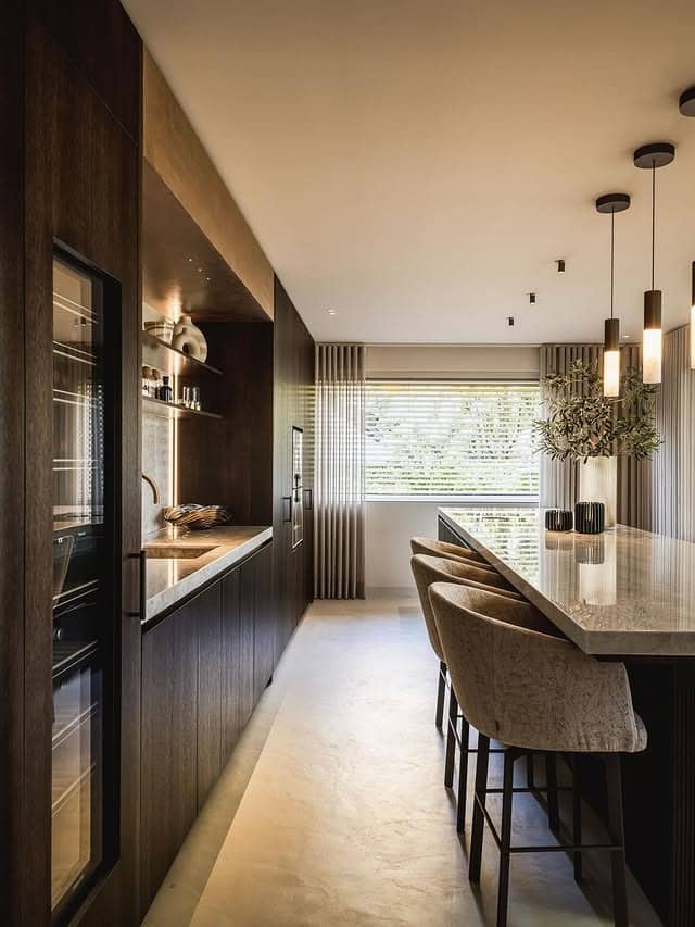 13. Dark Wood Linear Kitchen with Warm Ambient Lighting - long kitchen ideas
