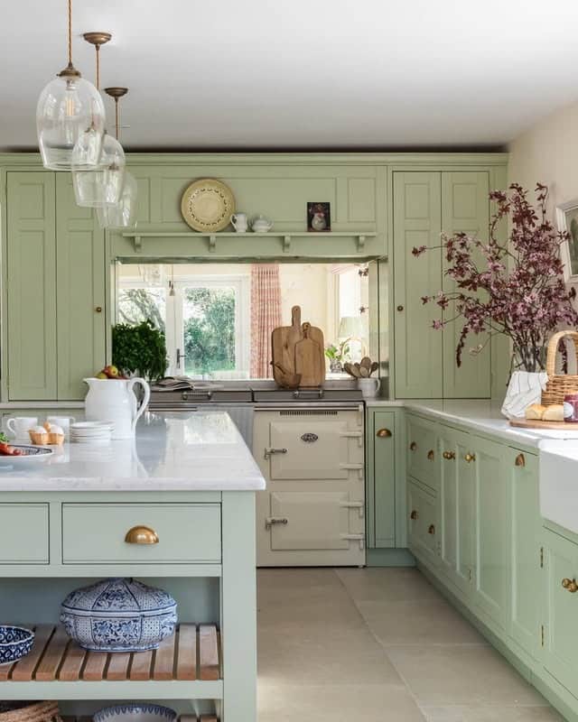 17. Sage Green Traditional Kitchen with Brass Details - long kitchen ideas