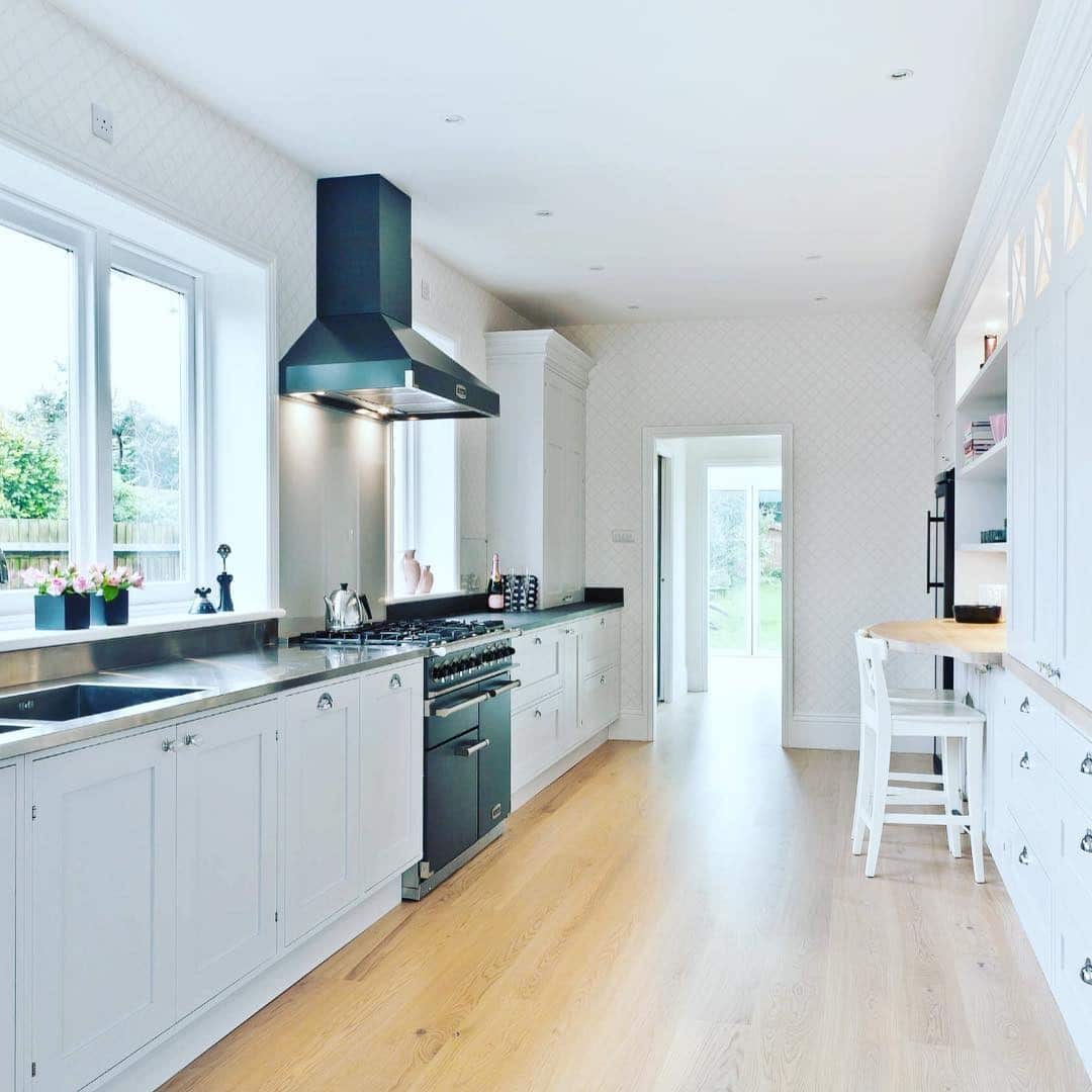 18. Classic White Galley Kitchen with Black Accents - long kitchen ideas
