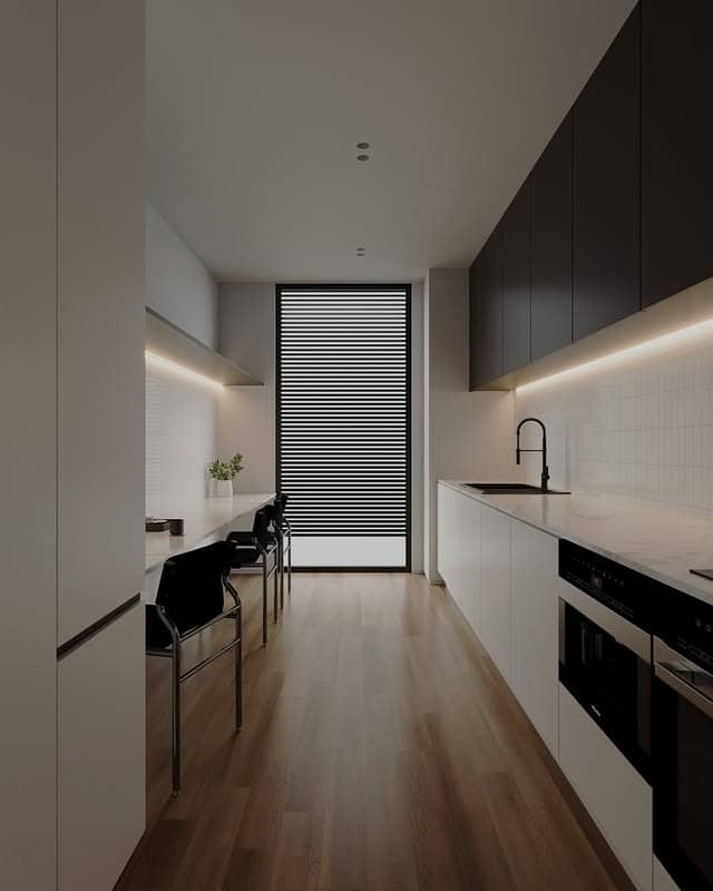 22. Minimalist Black and White Linear Kitchen with Warm Wood Flooring - long kitchen ideas